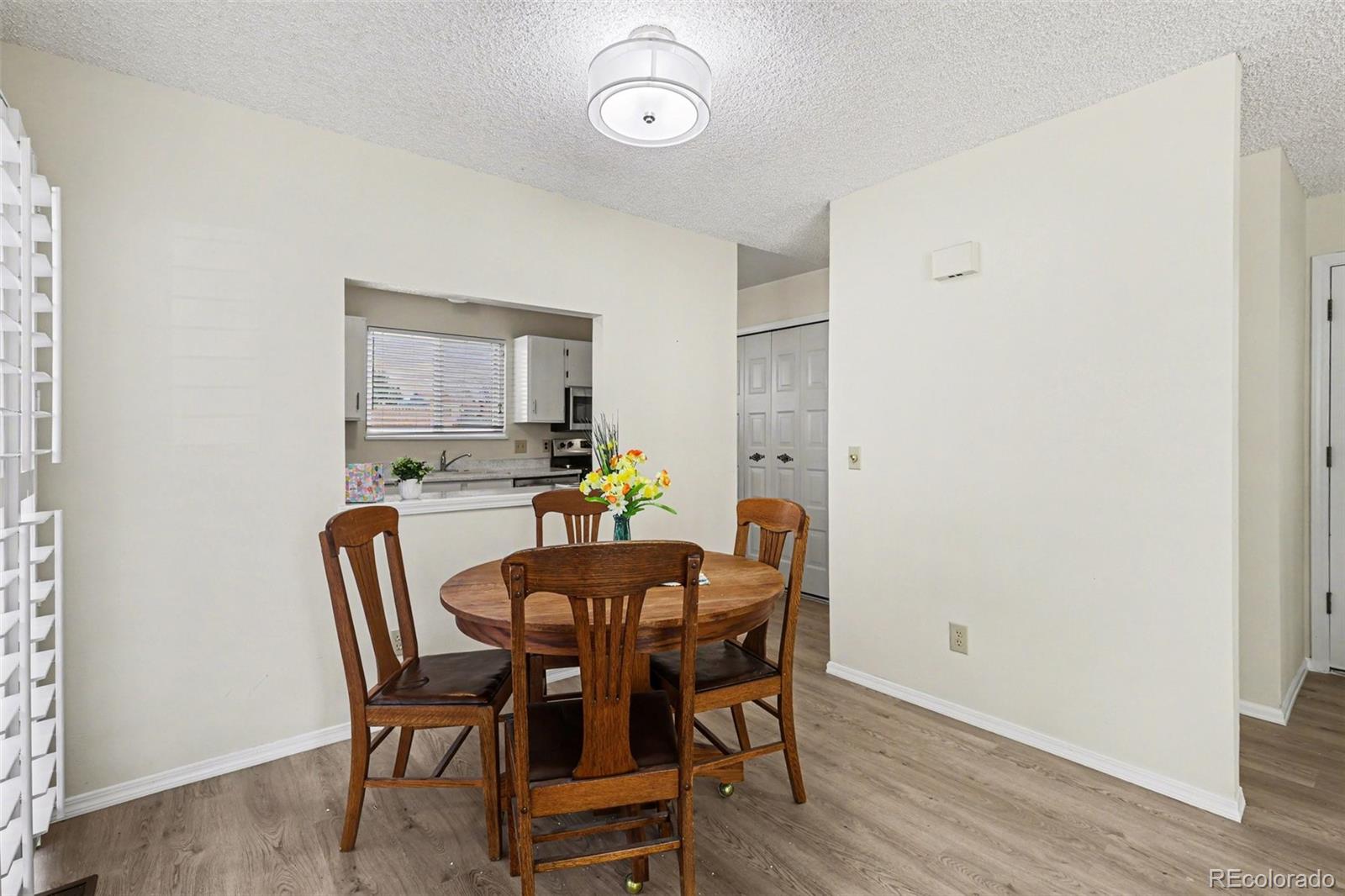 15922 East Rice Place, Unit B Aurora, CO 80015 - Photo 6 of 30 a view of a dining room with furniture and a window