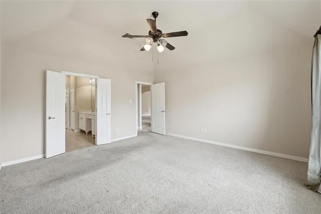 a view of a room with a ceiling fan