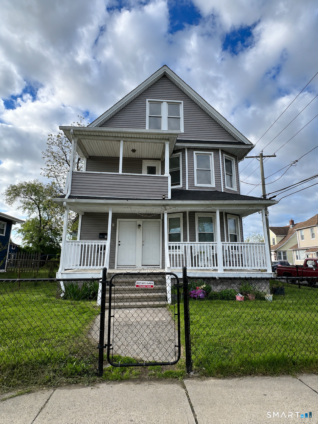 10 Beatrice Street, Unit 3 Bridgeport, CT 06607 - Photo 6 of 6 a front view of a house with a yard