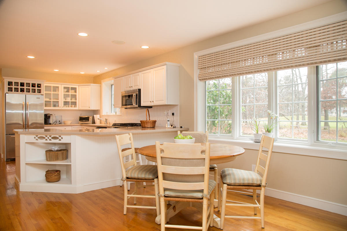 193 Midpine Road Cummaquid, MA 02675 - Photo 7 of 31 a kitchen with a stove a table and chairs