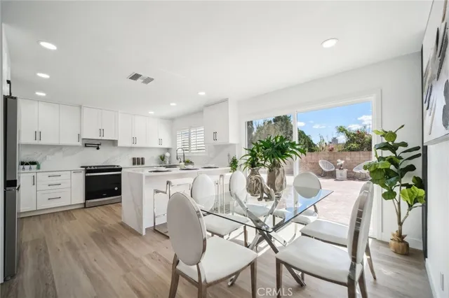 a kitchen with a white cabinets and white appliances