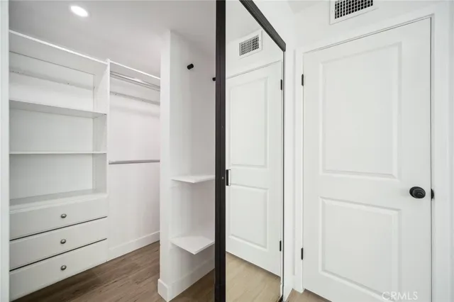 a view of an empty walk in closet