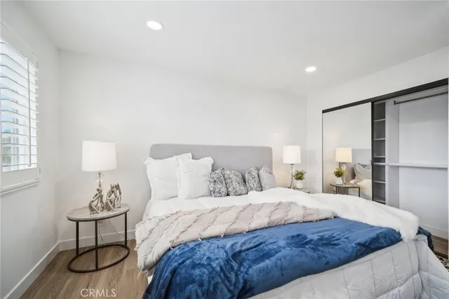 a bedroom with a bed and a cabinets