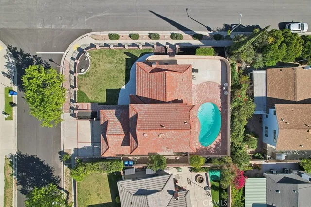 an aerial view of residential house with outdoor space and street view