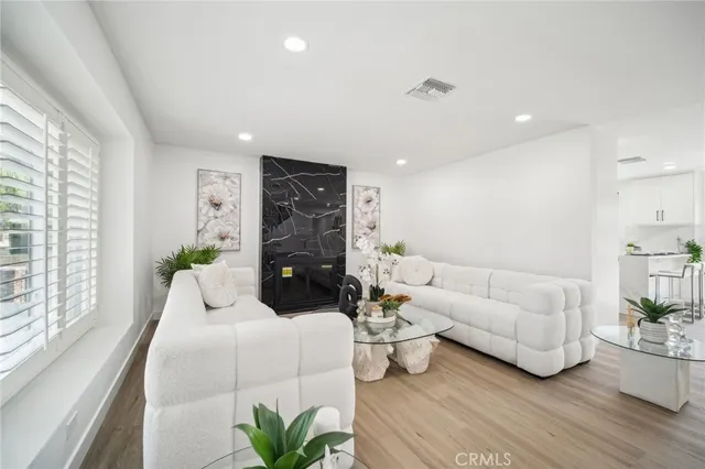 a living room with furniture or couch and a large window