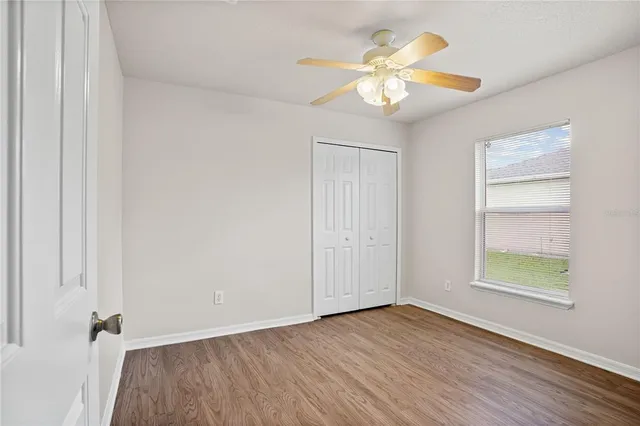 a view of an empty room and wooden floor