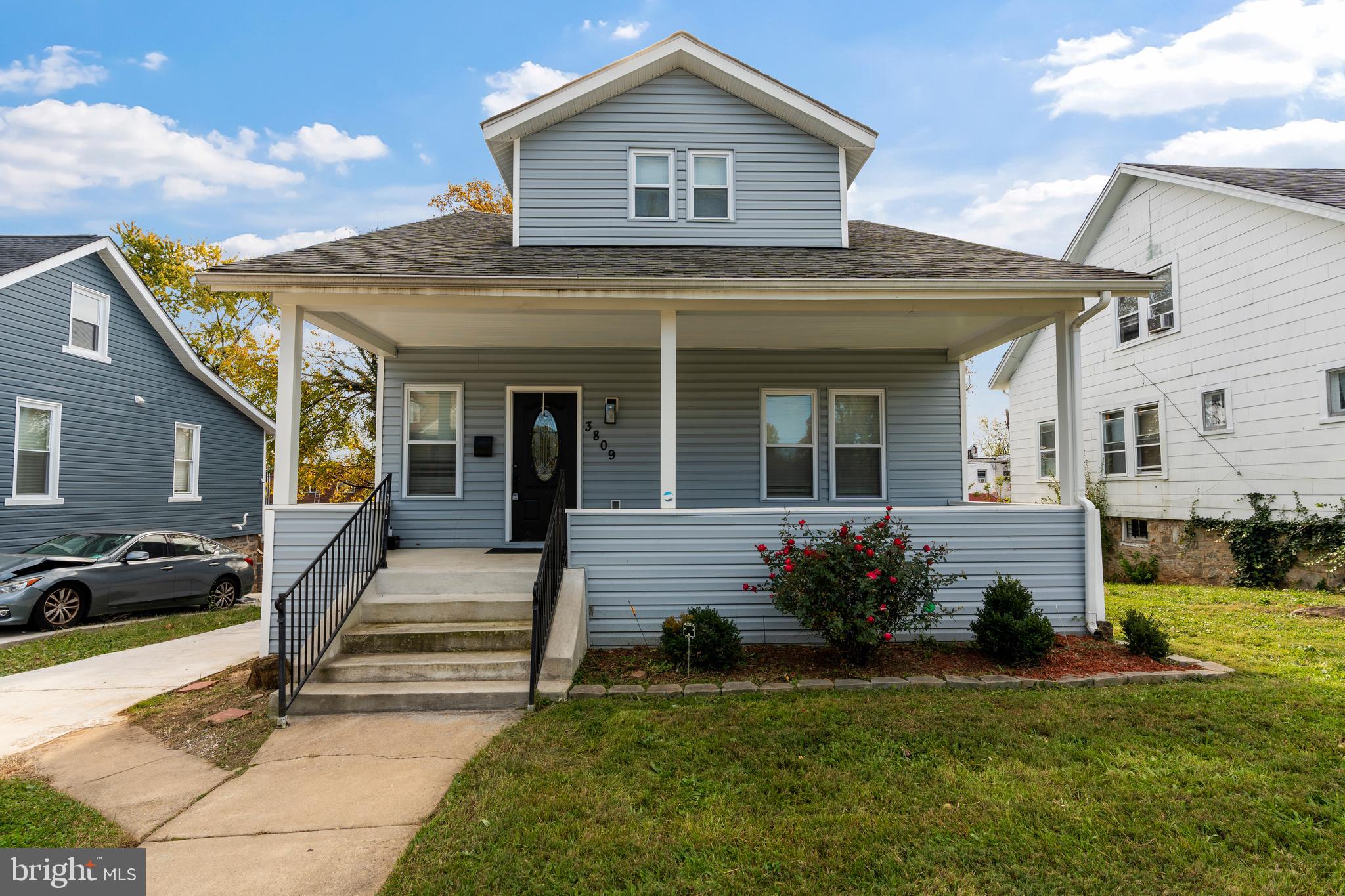 3809 West Cold Spring Lane Baltimore, MD 21215 - Photo 2 of 47 a front view of a house with a yard
