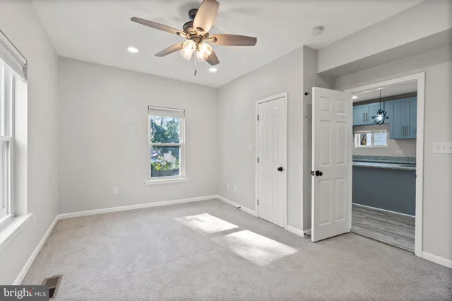 a view of an empty room with a window