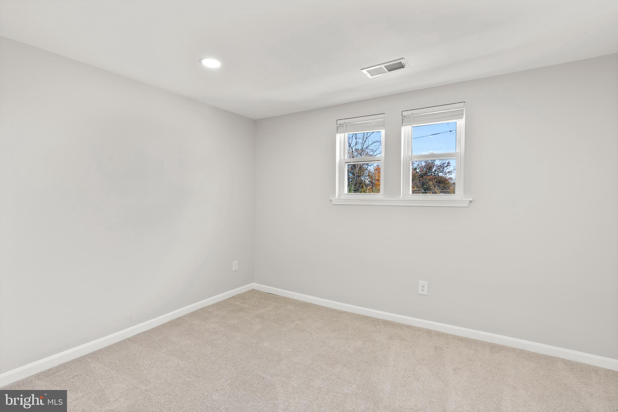 3809 West Cold Spring Lane Baltimore, MD 21215 - Photo 28 of 47 an empty room with windows