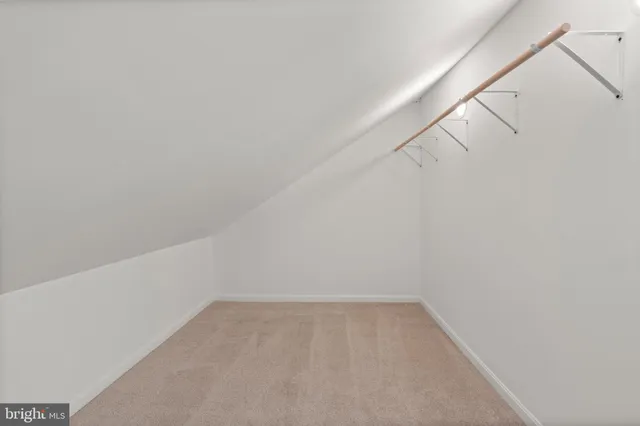 a view of an empty walk in closet