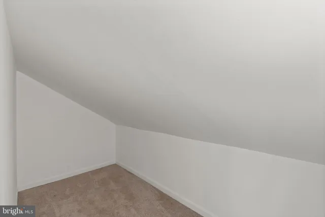 a view of balcony with wooden floor and fence