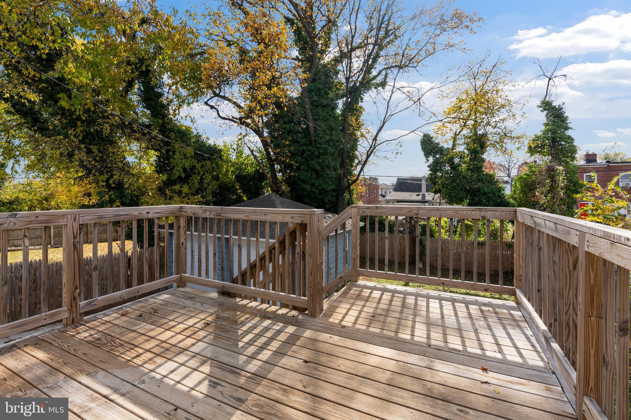 3809 West Cold Spring Lane Baltimore, MD 21215 - Photo 42 of 47 a view of balcony with wooden floor and fence
