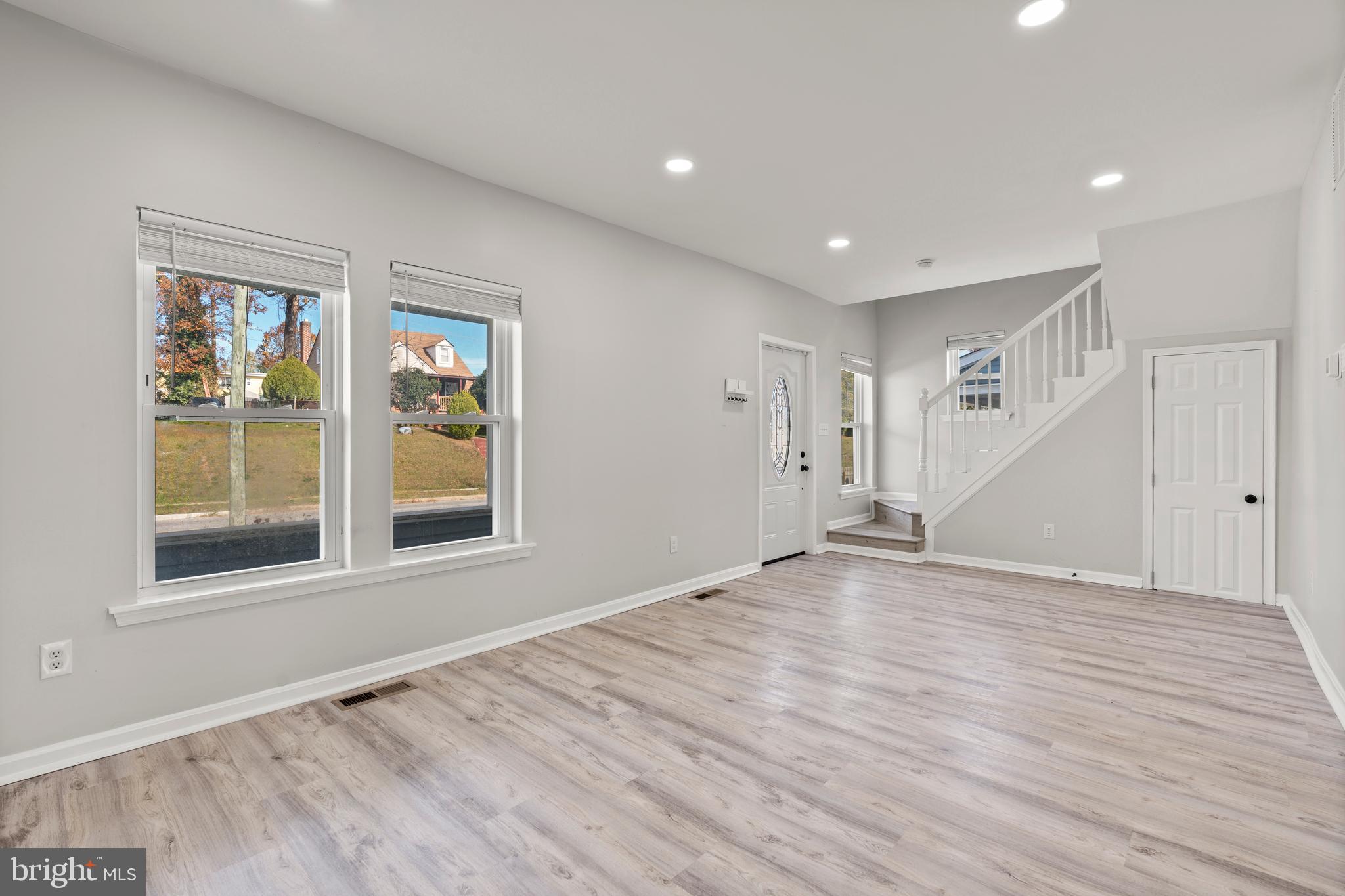 3809 West Cold Spring Lane Baltimore, MD 21215 - Photo 8 of 47 a view of empty room with wooden floor and fan