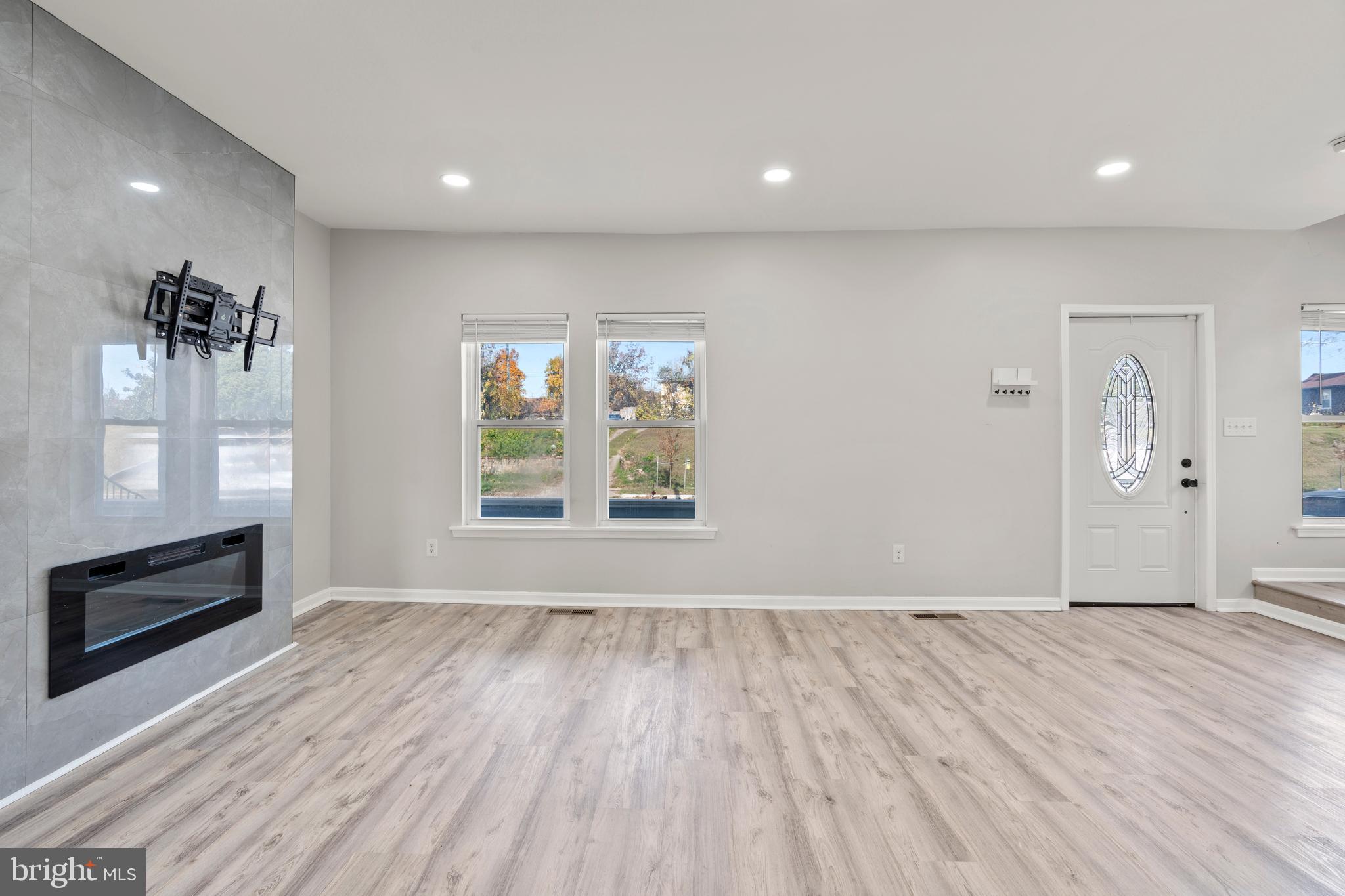 3809 West Cold Spring Lane Baltimore, MD 21215 - Photo 9 of 47 wooden floor in an empty room with a window