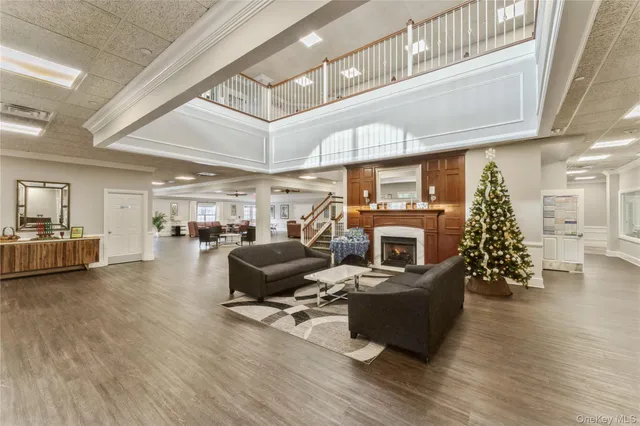 a living room with furniture fireplace and a window