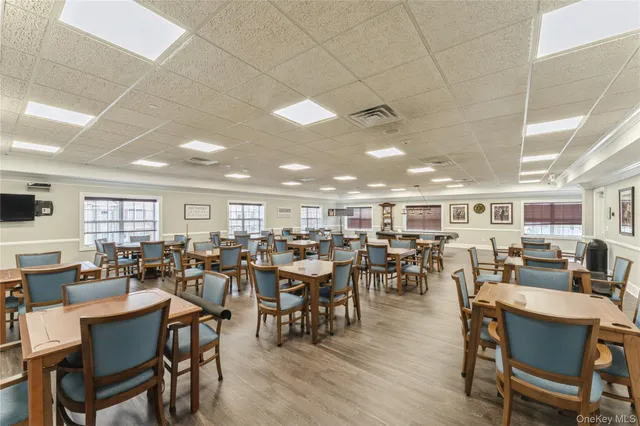 a room with lots of furniture and a wooden floor