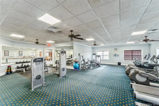 a living room with lots of furniture and a wooden floor