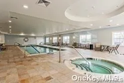 a swimming pool with outdoor seating and yard