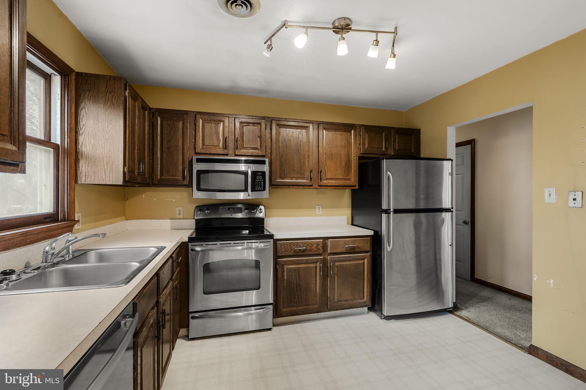 30 Buttonwood Drive Lititz, PA 17543 - Photo 17 of 43 a kitchen with a refrigerator sink and stove