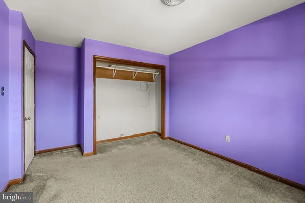 a view of a big room with windows