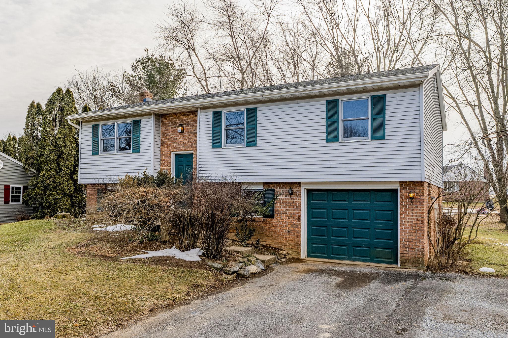 30 Buttonwood Drive Lititz, PA 17543 - Photo 3 of 43 a front view of house with yard and trees in the background