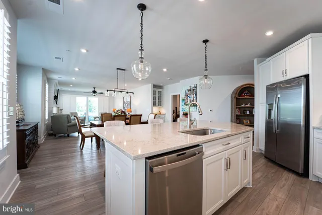 a large kitchen with stainless steel appliances kitchen island a island in the center