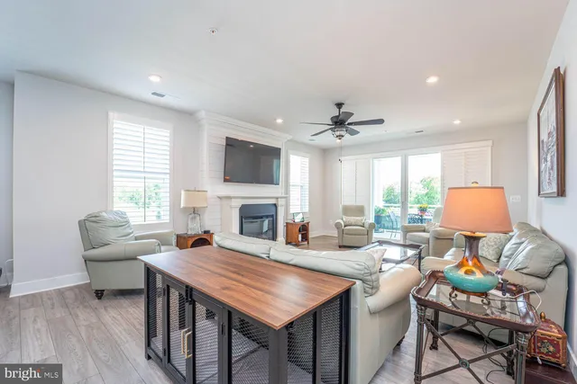 a living room with fireplace furniture and a flat screen tv