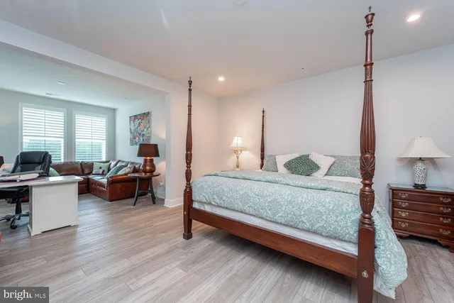 a bedroom with bed and window