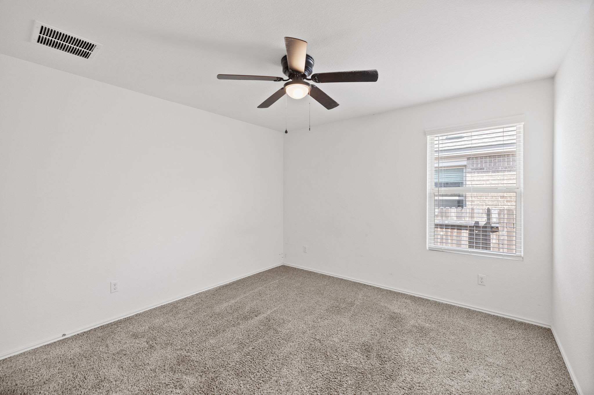 127 George Kimble Cove Bastrop, TX 78602 - Photo 22 of 40 Empty room with carpet and a ceiling fan