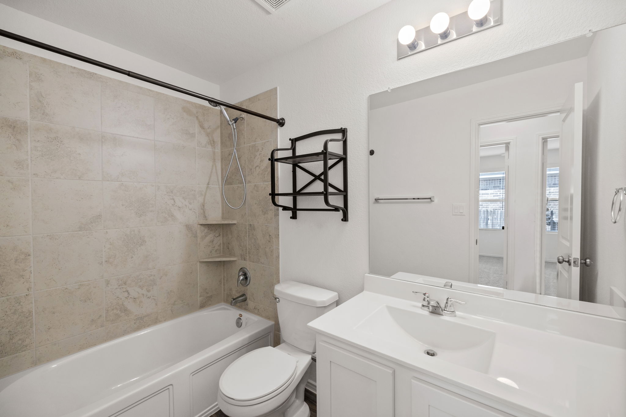 127 George Kimble Cove Bastrop, TX 78602 - Photo 25 of 40 Full bath featuring shower combination and vanity