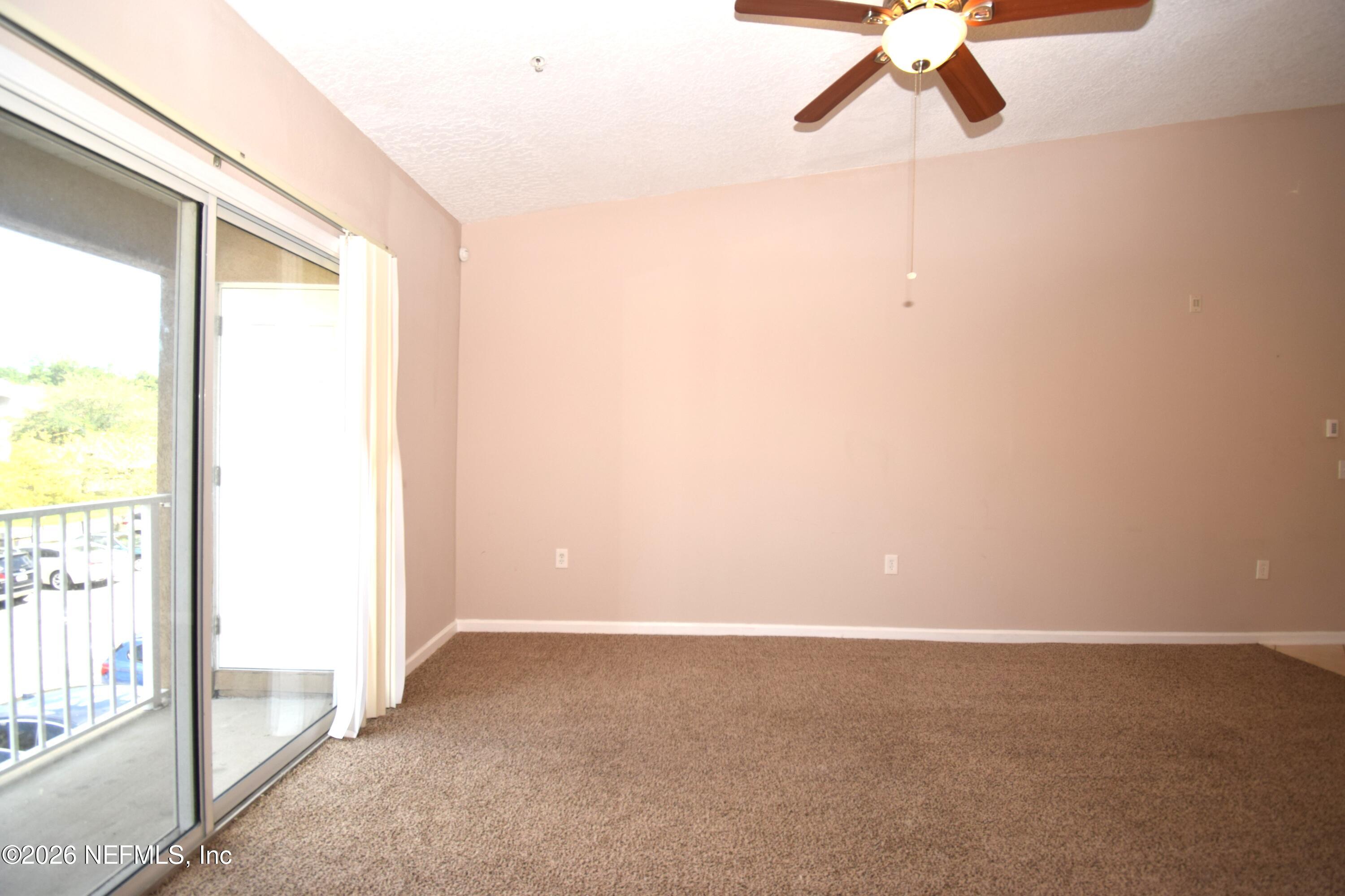 7920 Merrill Road, Unit 1811 Jacksonville, FL 32277 - Photo 4 of 15 a view of a small space with a window