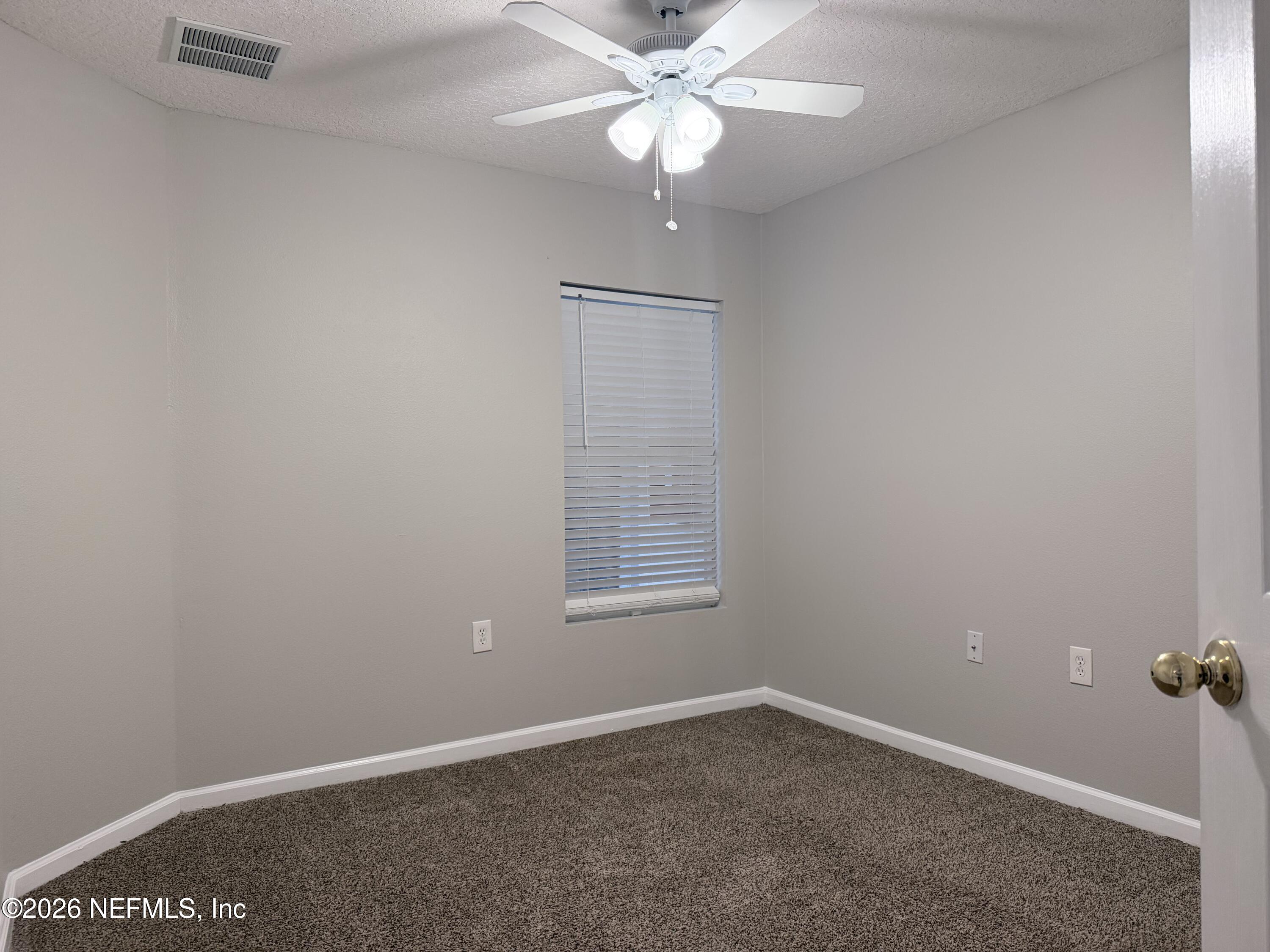 7920 Merrill Road, Unit 1811 Jacksonville, FL 32277 - Photo 8 of 11 Second bedroom