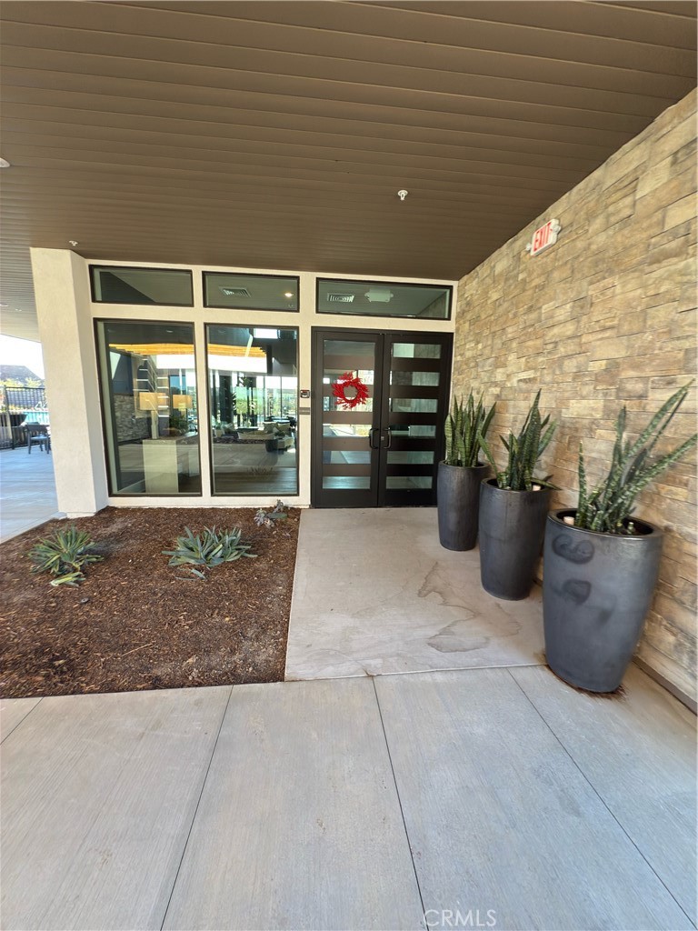 15844 Caterpillar Drive Fontana, CA 92336 - Photo 13 of 19 a view of a patio with table and chairs potted plants