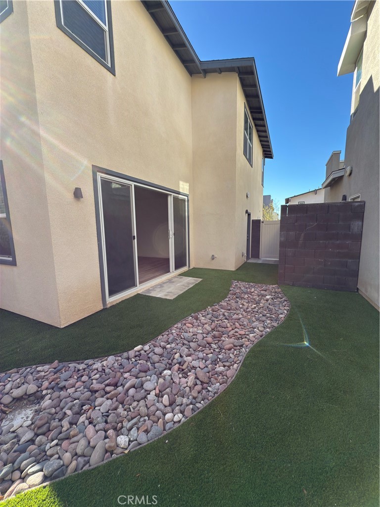 15844 Caterpillar Drive Fontana, CA 92336 - Photo 6 of 19 a front view of a house having yard