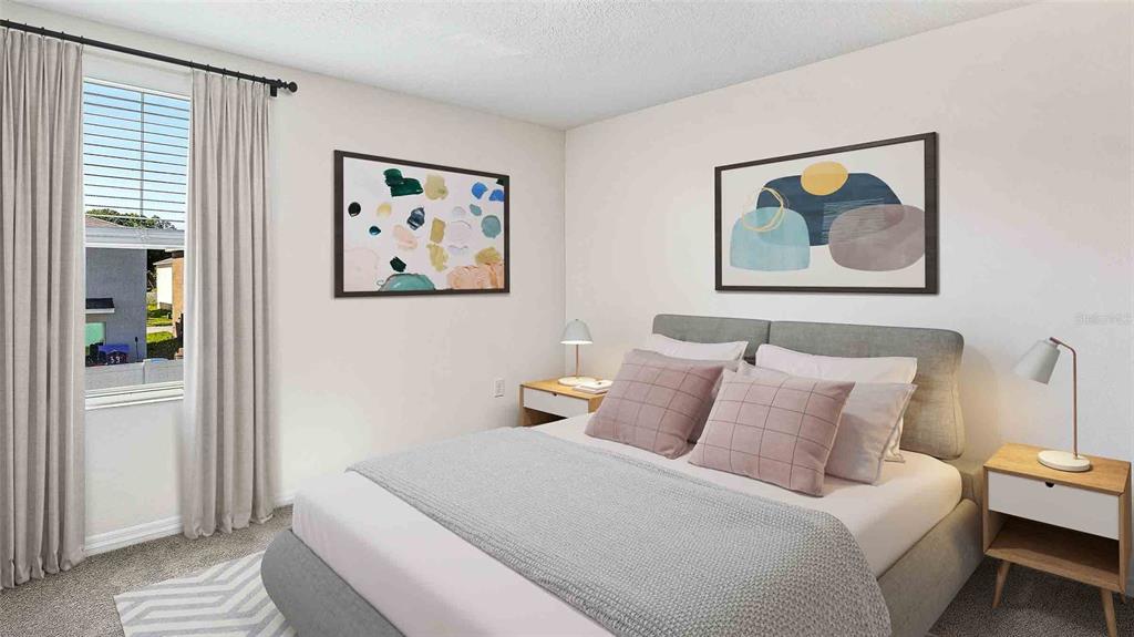 8607 Southwest 44th Terrace Ocala, FL 34476 - Photo 8 of 14 a bedroom with a bed and a painting on the wall