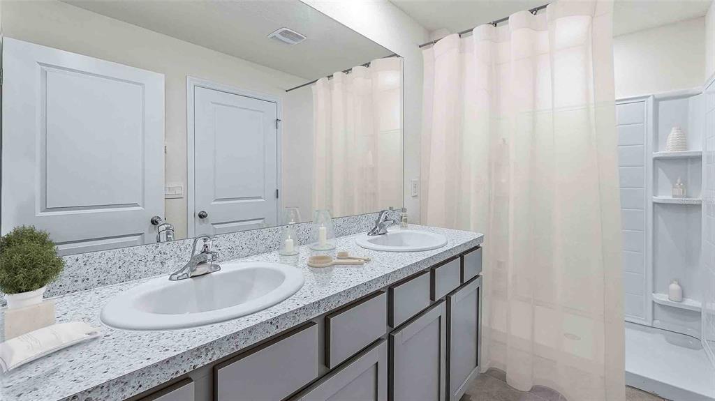 8607 Southwest 44th Terrace Ocala, FL 34476 - Photo 10 of 14 a bathroom with a granite countertop sink and a mirror