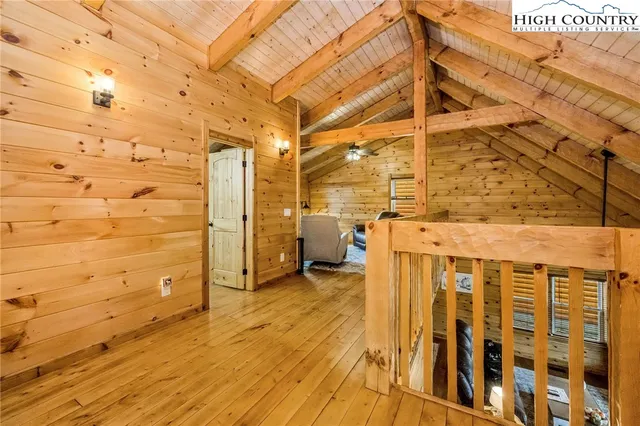 a view of a bathroom with wooden floor