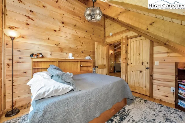 a bedroom with a bed and a walk in closet