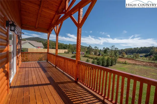 a view of balcony with wooden floor