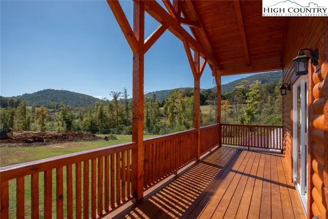 a view of a balcony with wooden floor