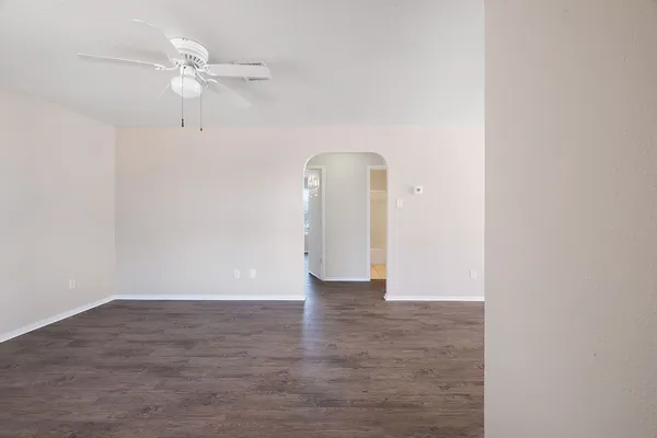 a view of an empty room with a fan