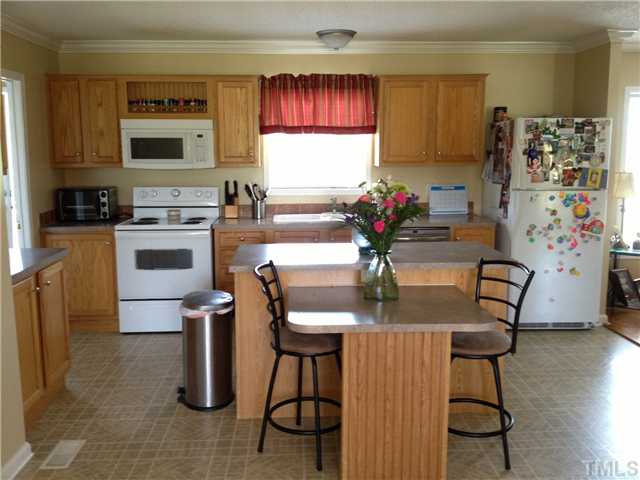 2762 Old Allensville Road Roxboro, NC 27574 - Photo 3 of 6 Kitchen boast lots of cabinets and eat at bar