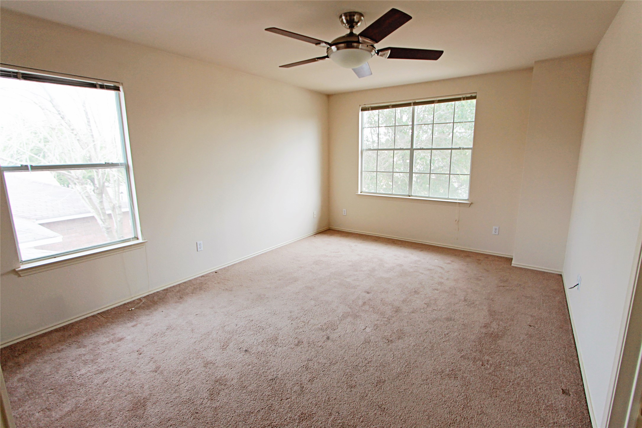 1821 Friars Tale Lane Austin, TX 78748 - Photo 11 of 20 Carpeted spare room with ceiling fan and baseboards