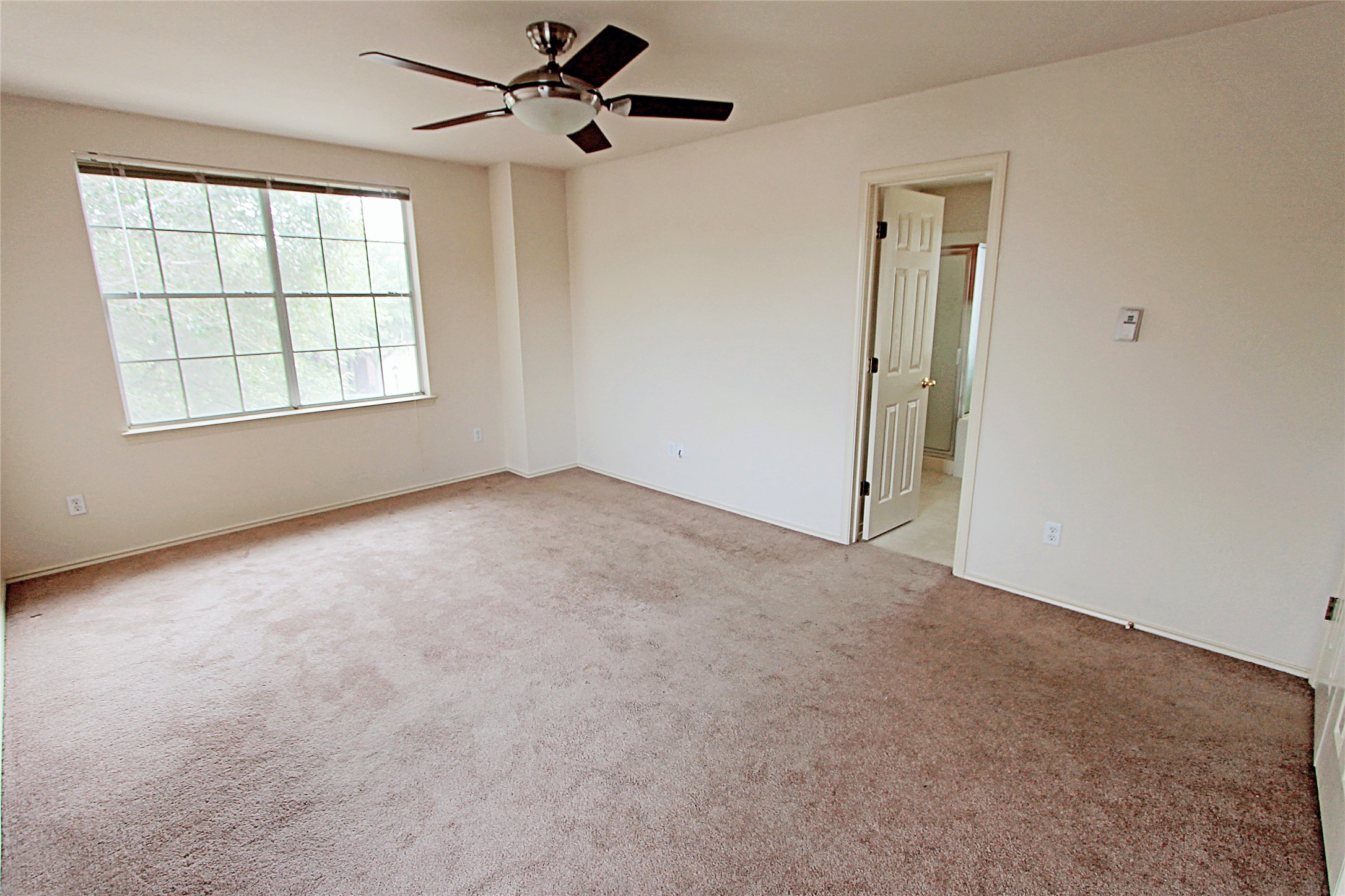 1821 Friars Tale Lane Austin, TX 78748 - Photo 12 of 20 Empty room featuring ceiling fan and light carpet