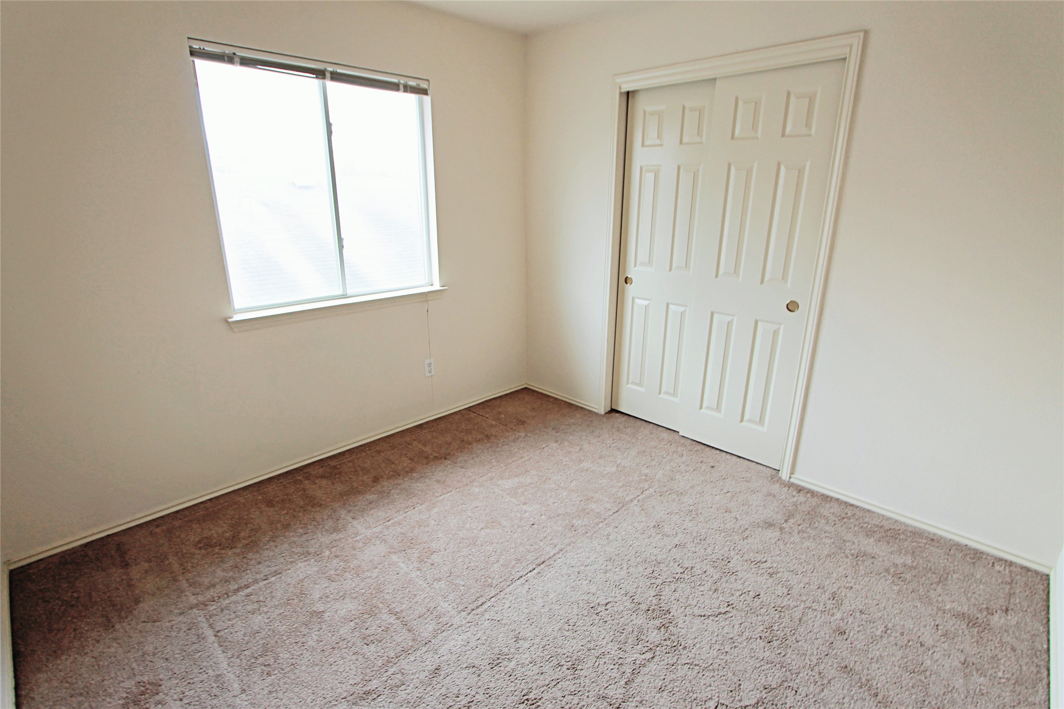 1821 Friars Tale Lane Austin, TX 78748 - Photo 14 of 20 Unfurnished bedroom featuring a closet and light carpet