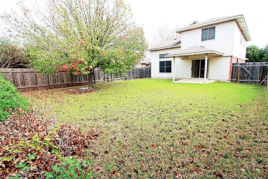 1821 Friars Tale Lane Austin, TX 78748 - Photo 20 of 20 Back of property with a patio and a fenced backyard
