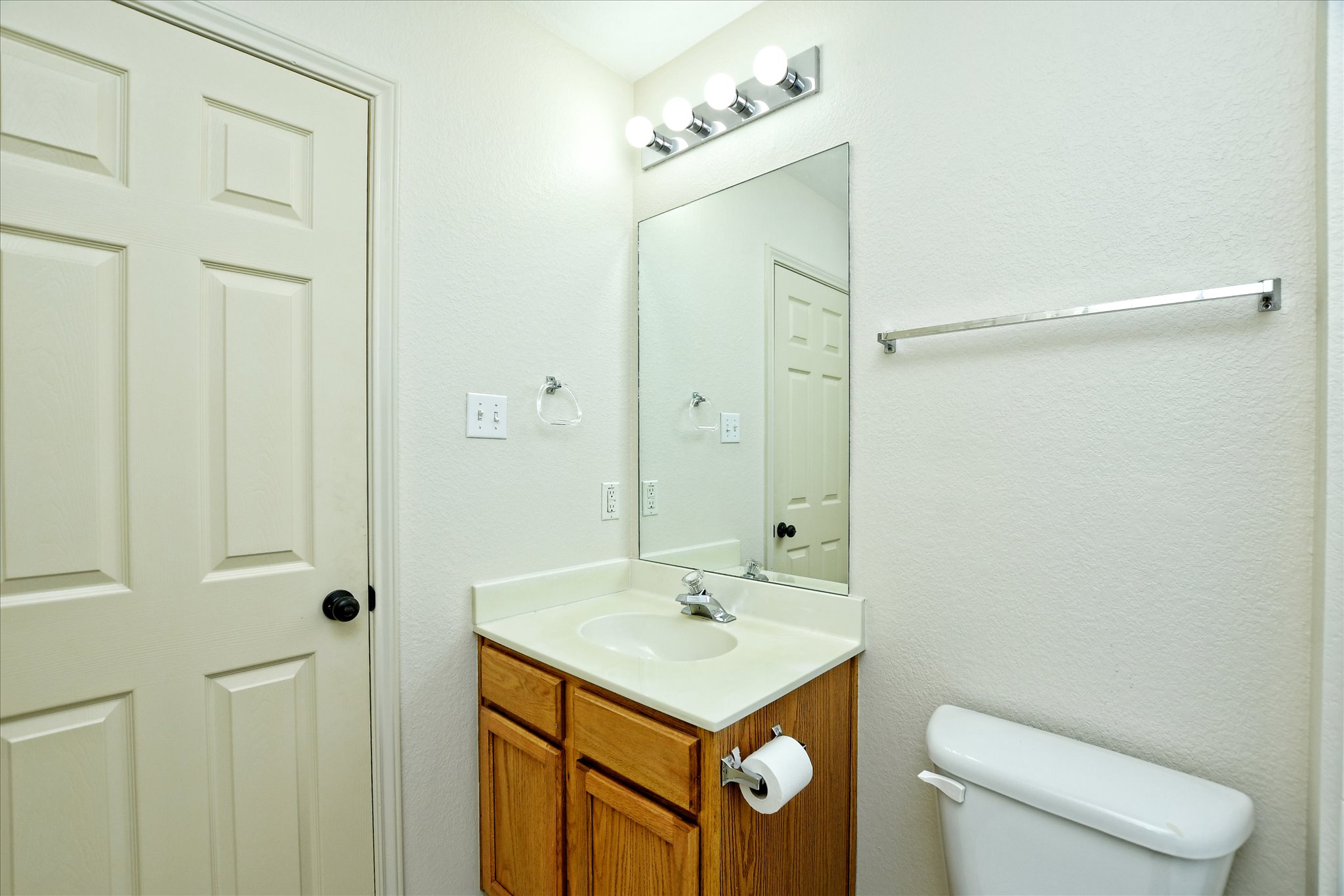 4400 Switch Willo, Unit 9 Austin, TX 78727 - Photo 21 of 30 Half bathroom featuring vanity and a textured wall