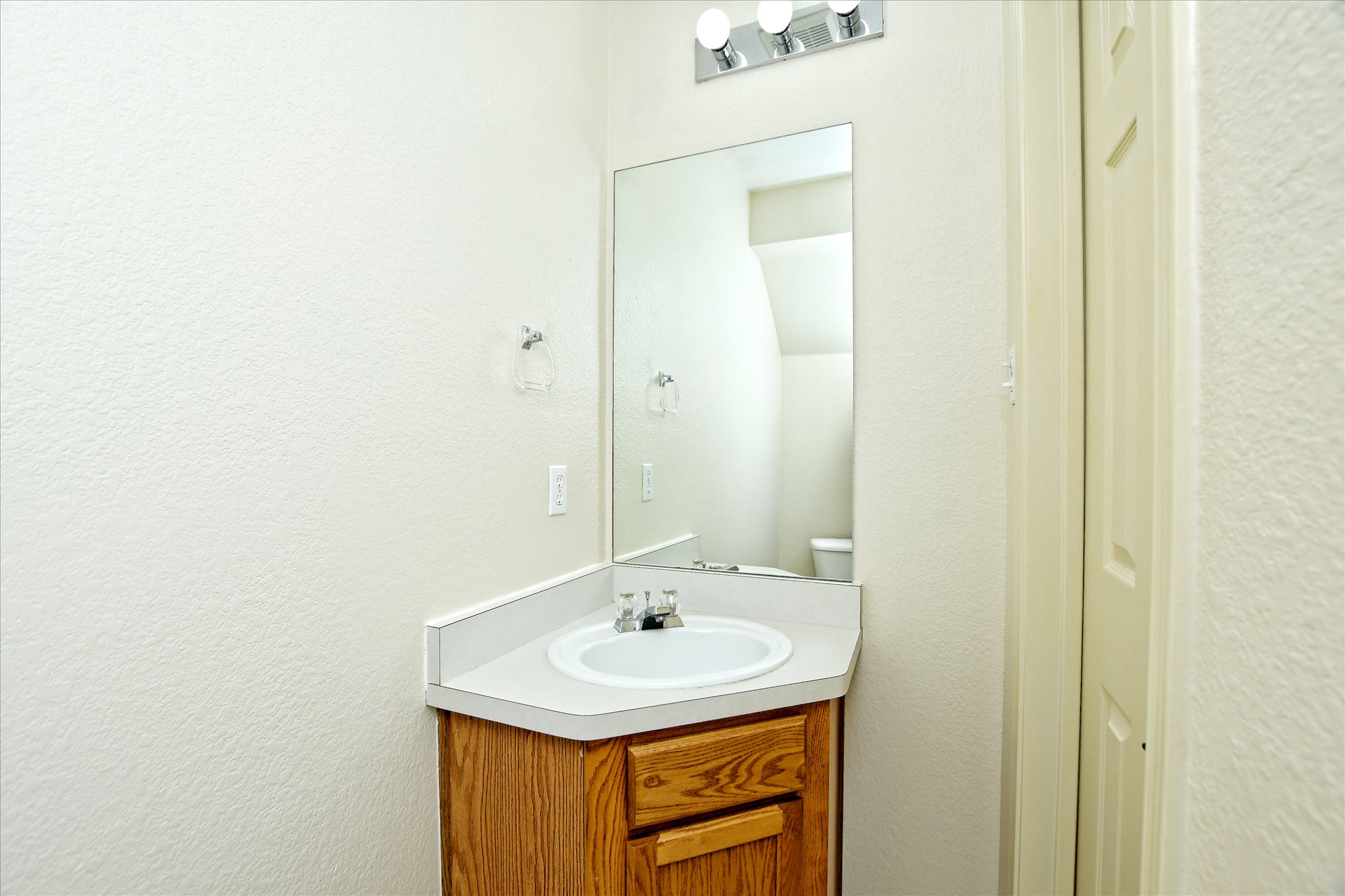 4400 Switch Willo, Unit 9 Austin, TX 78727 - Photo 24 of 30 Half bath featuring vanity and toilet