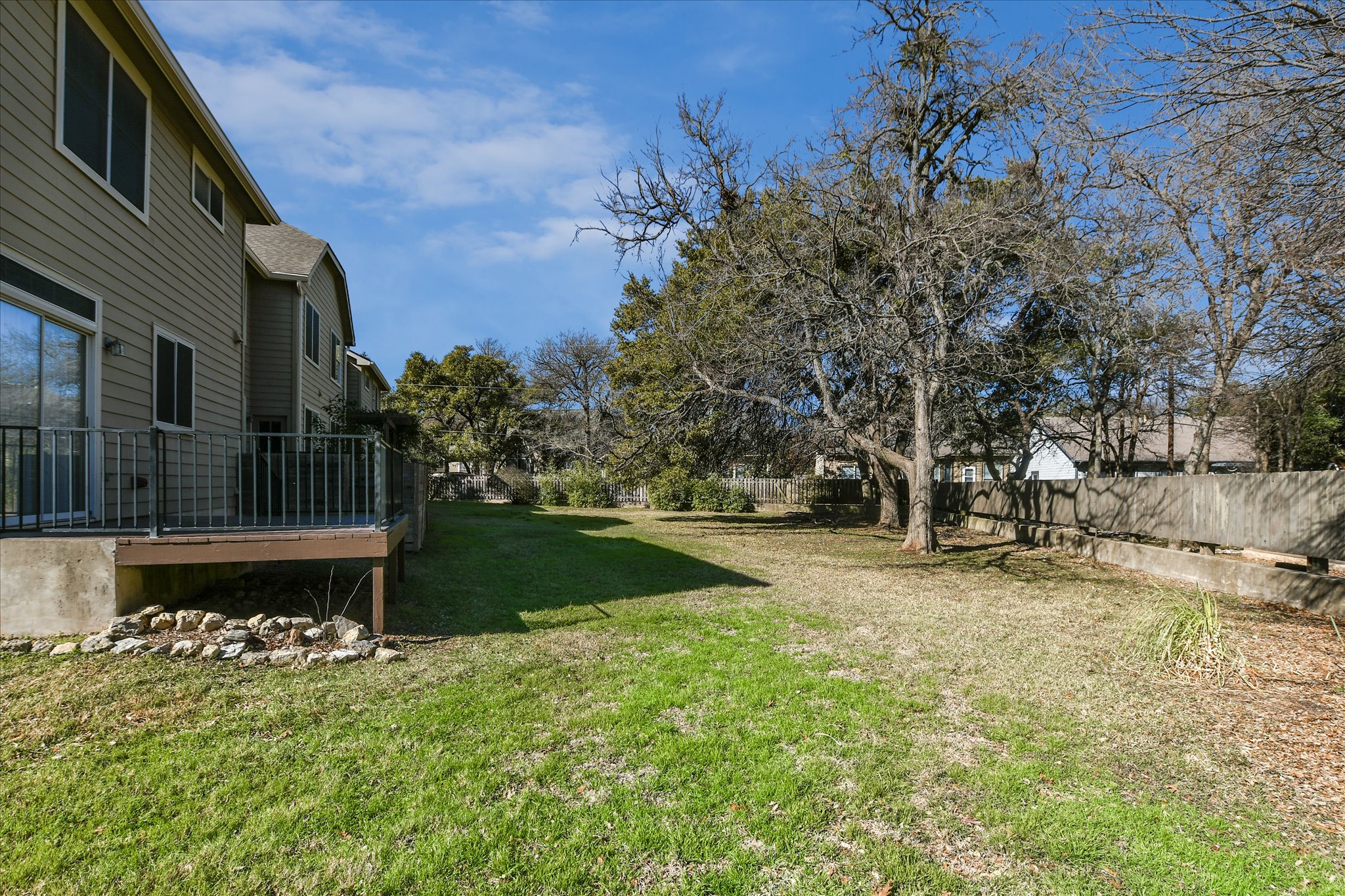 4400 Switch Willo, Unit 9 Austin, TX 78727 - Photo 27 of 30 View of yard featuring a wooden deck