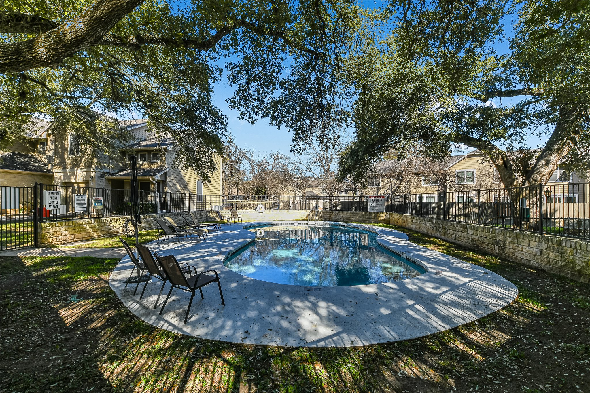 4400 Switch Willo, Unit 9 Austin, TX 78727 - Photo 29 of 30 Community pool with a patio area and a fenced backyard